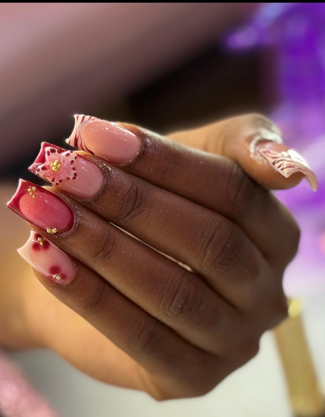 Floral nail art created at Pink Nail Studio