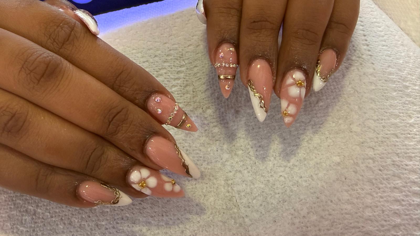 White, pink and gold floral nail design